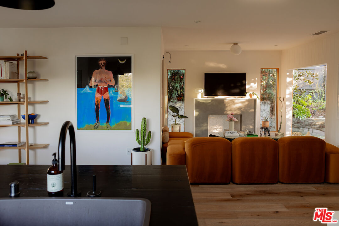 2139 Baxter Street Los Angeles, CA 90039 - Photo 12 of 55 a living room with furniture a flat screen tv and a window