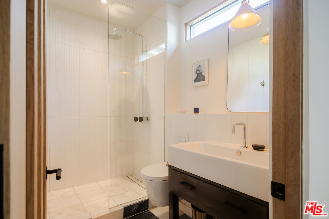 2139 Baxter Street Los Angeles, CA 90039 - Photo 21 of 55 a bathroom with a sink a toilet and shower