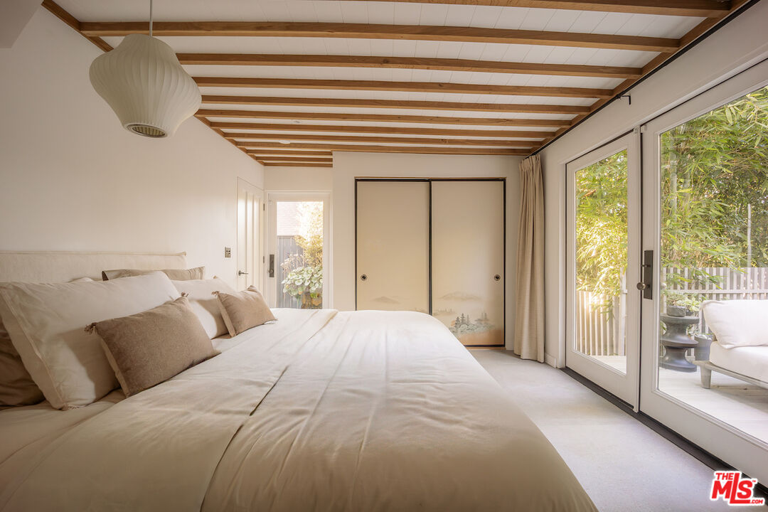 2139 Baxter Street Los Angeles, CA 90039 - Photo 32 of 55 a spacious bedroom with a bed and a large window
