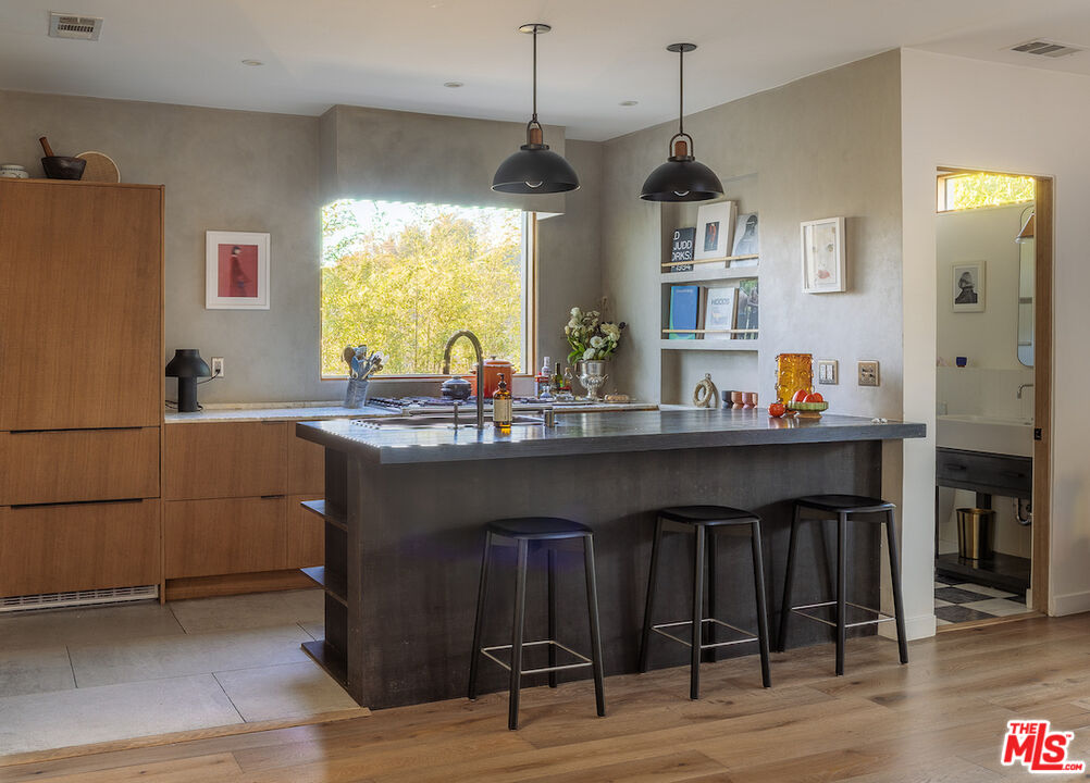 2139 Baxter Street Los Angeles, CA 90039 - Photo 10 of 55 a kitchen with a sink cabinets and wooden floor