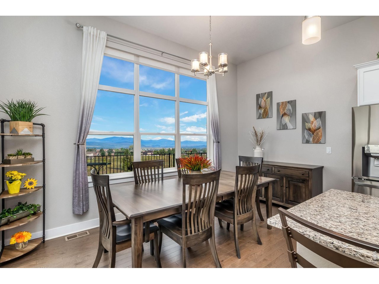 3789 Bridle Ridge Circle Severance, CO 80524 - Photo 10 of 44 a view of a dining room with furniture and chandelier