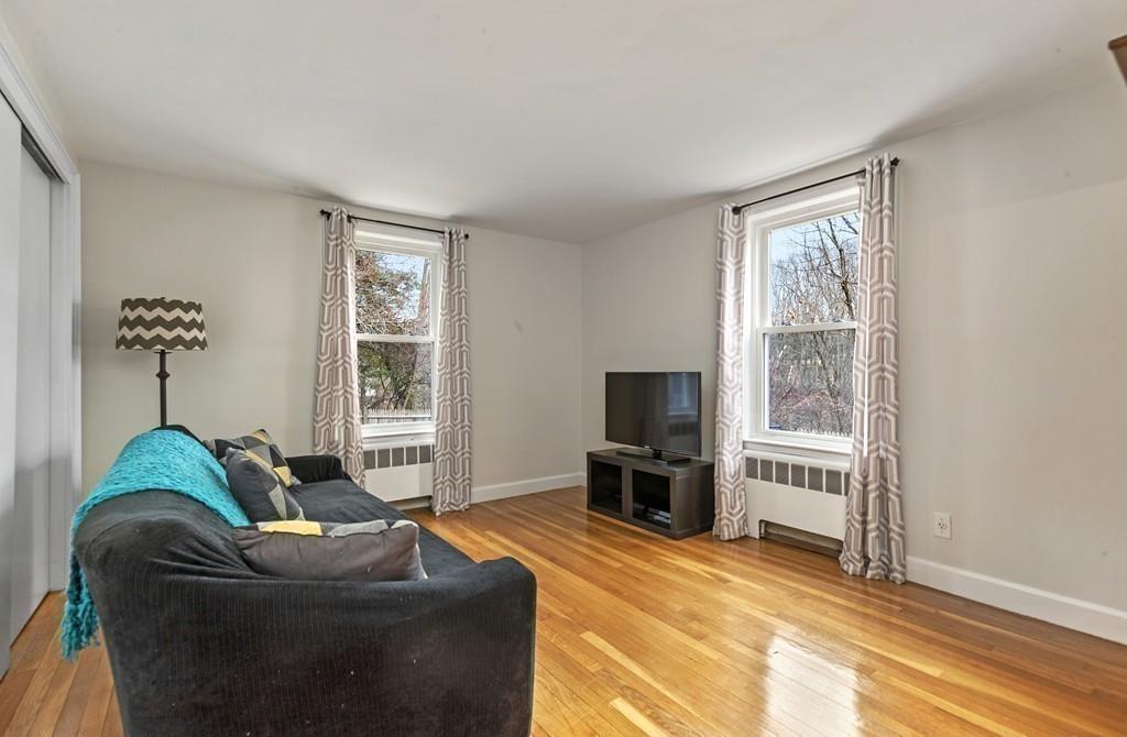 152 Boston Post Road Wayland, MA 01778 - Photo 20 of 25 a living room with furniture and a flat screen tv