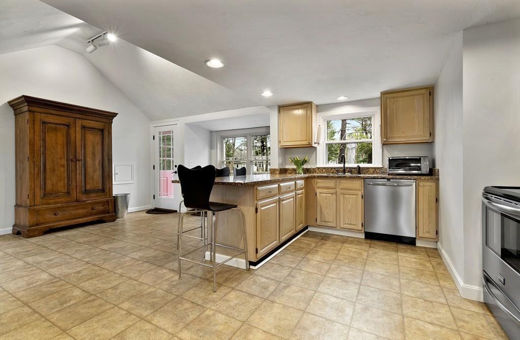 152 Boston Post Road Wayland, MA 01778 - Photo 4 of 25 a kitchen with a sink a counter top space appliances and cabinets
