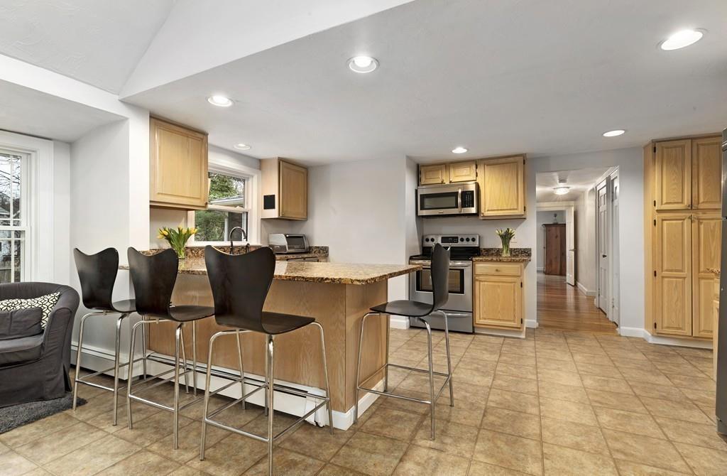 152 Boston Post Road Wayland, MA 01778 - Photo 6 of 25 a living room with furniture and kitchen view