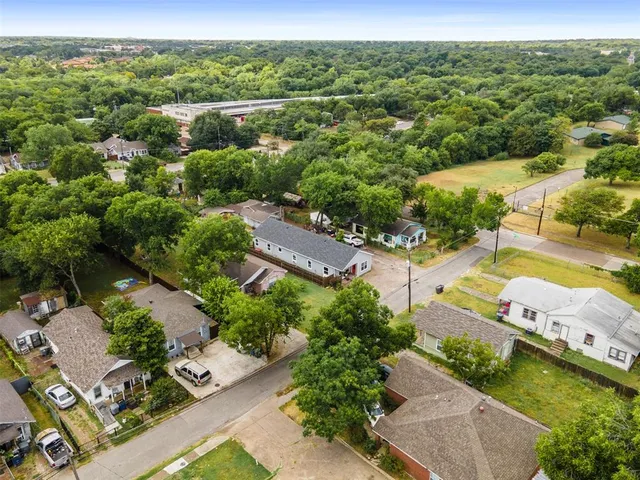 an aerial view of a city with mountains
