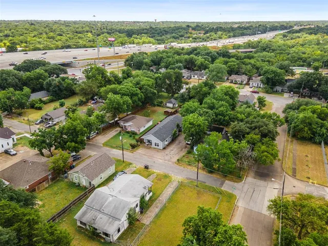 an aerial view of a house with a lake view