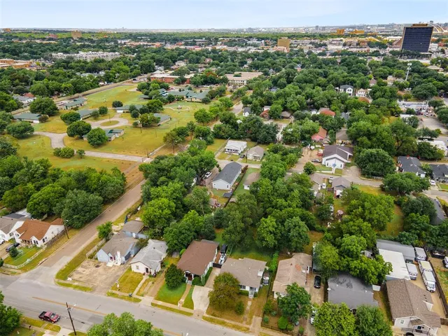 an aerial view of residential houses with outdoor space