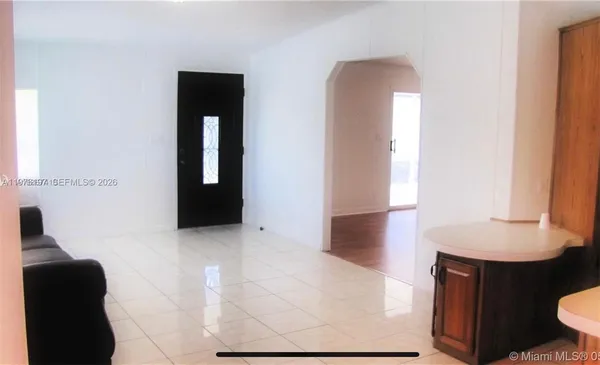 a view of livingroom with furniture and a window