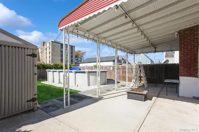 a view of a backyard with sitting area