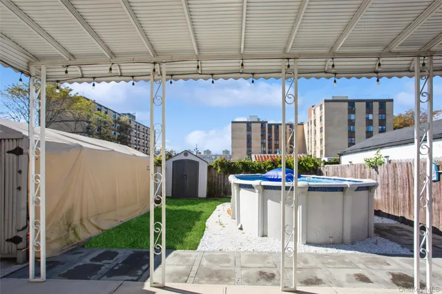 a view of a patio with table and chairs potted plants
