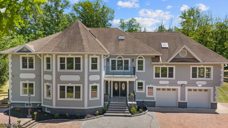 a aerial view of a brick house many windows