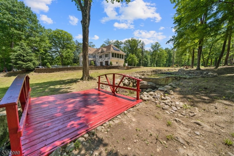 47 Cutlass Road Kinnelon, NJ 07405 - Photo 15 of 42 a view of a yard with wooden floor