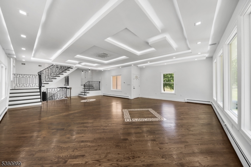 47 Cutlass Road Kinnelon, NJ 07405 - Photo 30 of 42 an empty room with wooden floor and windows
