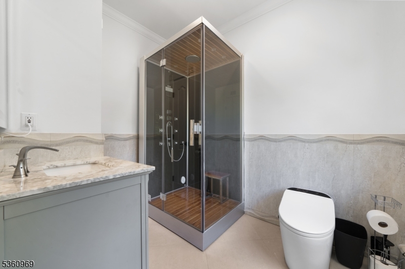 47 Cutlass Road Kinnelon, NJ 07405 - Photo 35 of 42 a bathroom with a granite countertop sink a toilet and a mirror