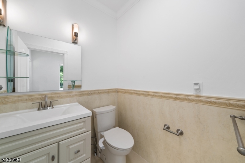 47 Cutlass Road Kinnelon, NJ 07405 - Photo 38 of 42 a bathroom with a sink mirror vanity and toilet