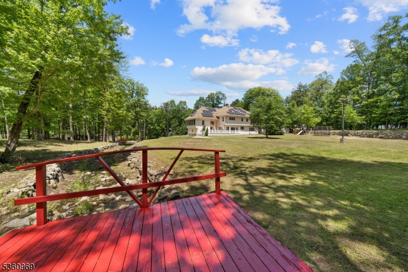 47 Cutlass Road Kinnelon, NJ 07405 - Photo 7 of 42 a view of a swimming pool with a patio