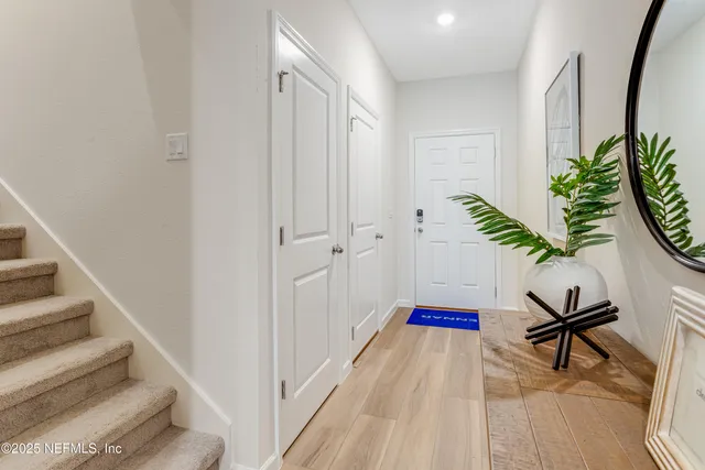 a view of entryway with wooden floor
