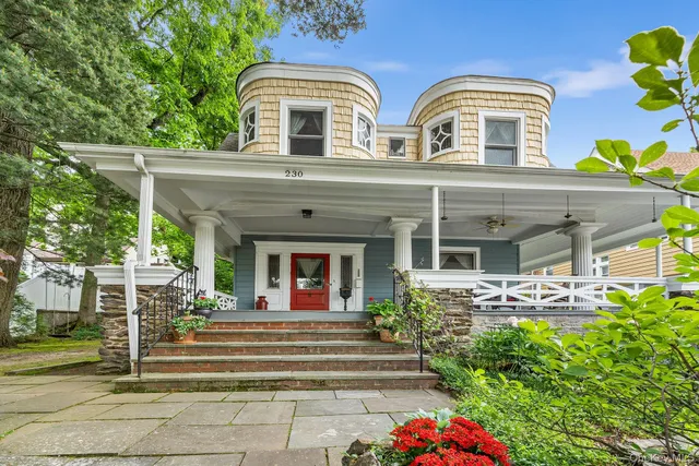 front view of a house with a garden