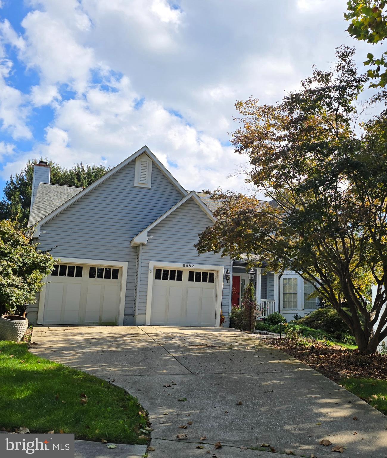 8682 Open Meadow Way Columbia, MD 21045 - Photo 3 of 13 a front view of a house with a garden