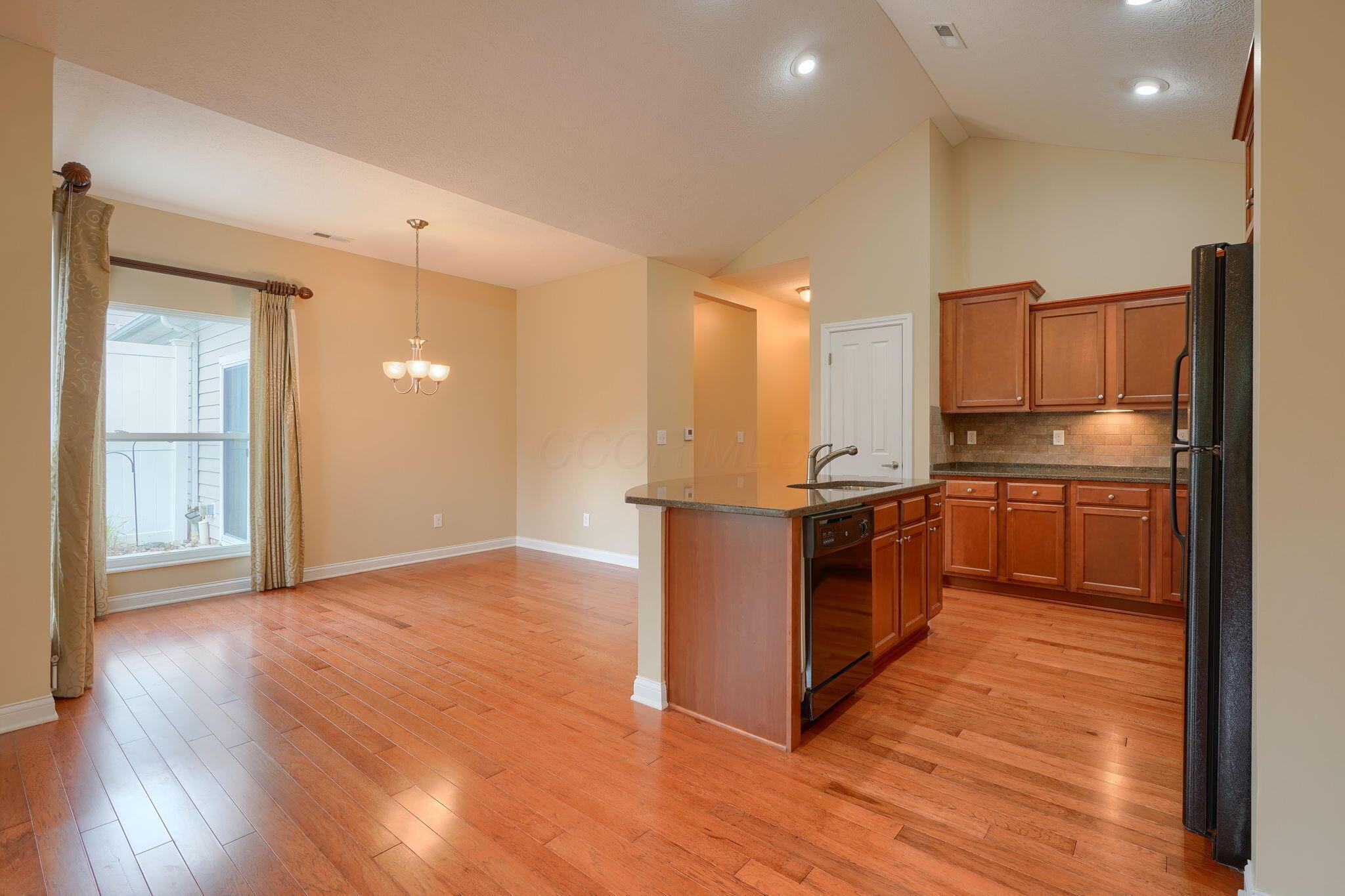 6911 Rothwell Street, Unit 5 New Albany, OH 43054 - Photo 17 of 44 View to kitchen & dining rooms