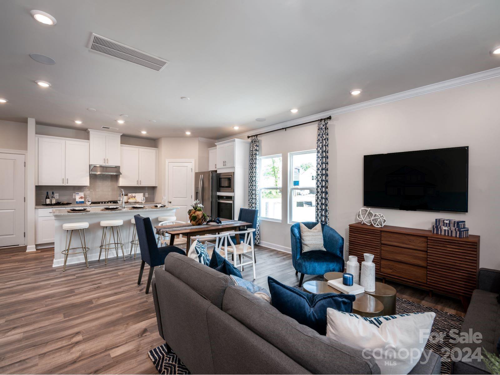 348 Cedar Knoll Circle Pineville, NC 28134 - Photo 4 of 19 a living room with furniture and a flat screen tv