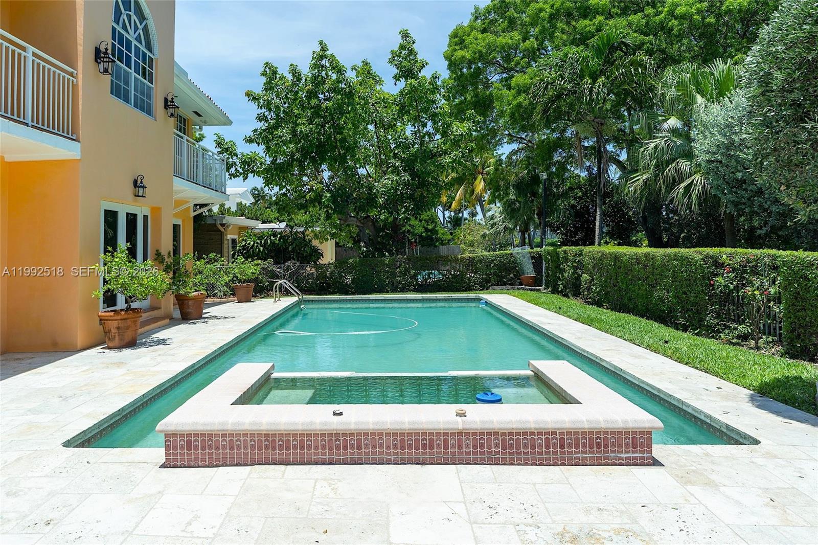 5309 Alton Road Miami Beach, FL 33140 - Photo 38 of 51 a view of backyard with swimming pool and seating space