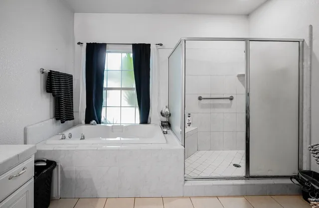 a bathroom with a bathtub and a sink