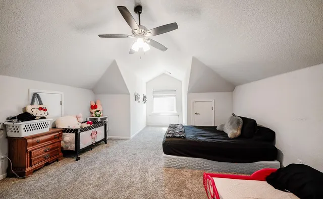 a bathroom with a sink a washer and dryer next to a window