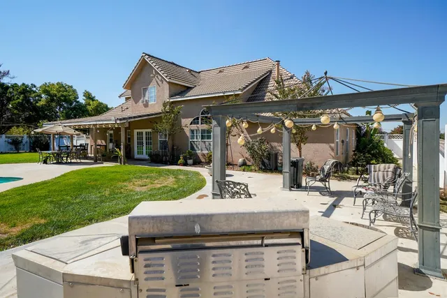 a view of a swimming pool with a patio