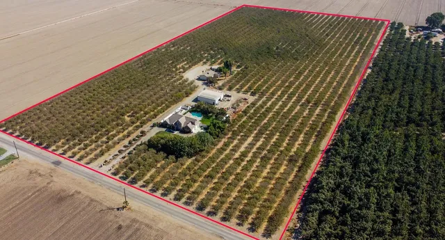 an aerial view of a house with outdoor space