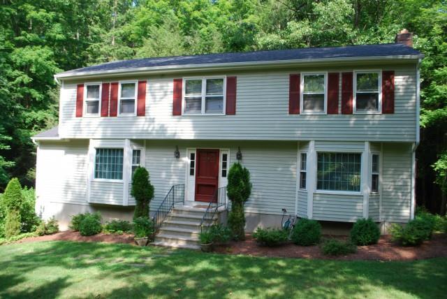 7 Timbermill Road Newtown, CT 06482 - Photo 1 of 1 a front view of a house with a garden