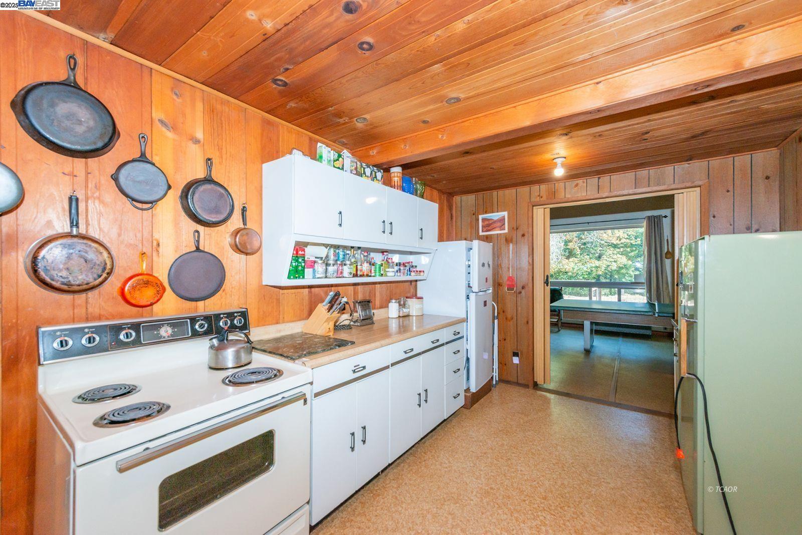 181 Price Creek Road Big Bar, CA 96010 - Photo 15 of 49 a kitchen with a stove and a refrigerator