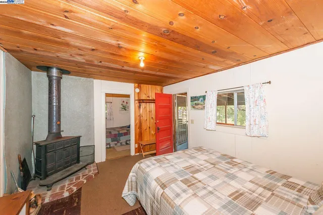 a bedroom with a bed and a table in it