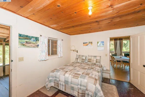 a bedroom with furniture and a window