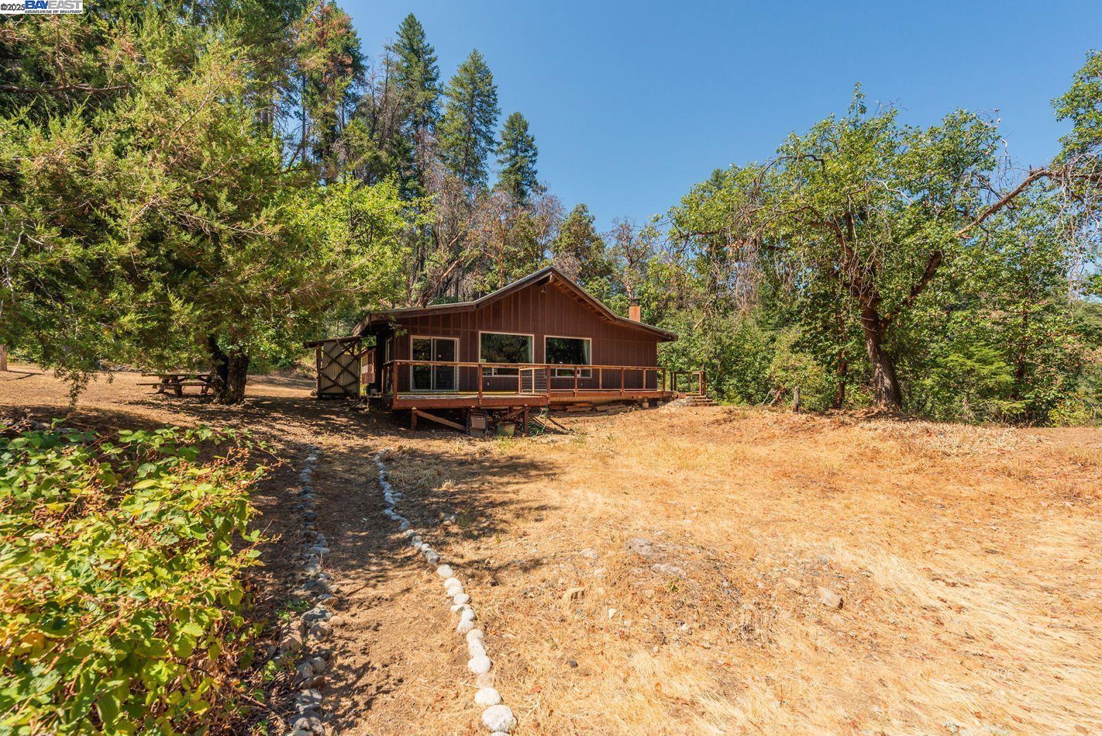 181 Price Creek Road Big Bar, CA 96010 - Photo 2 of 49 a front view of a house with a yard
