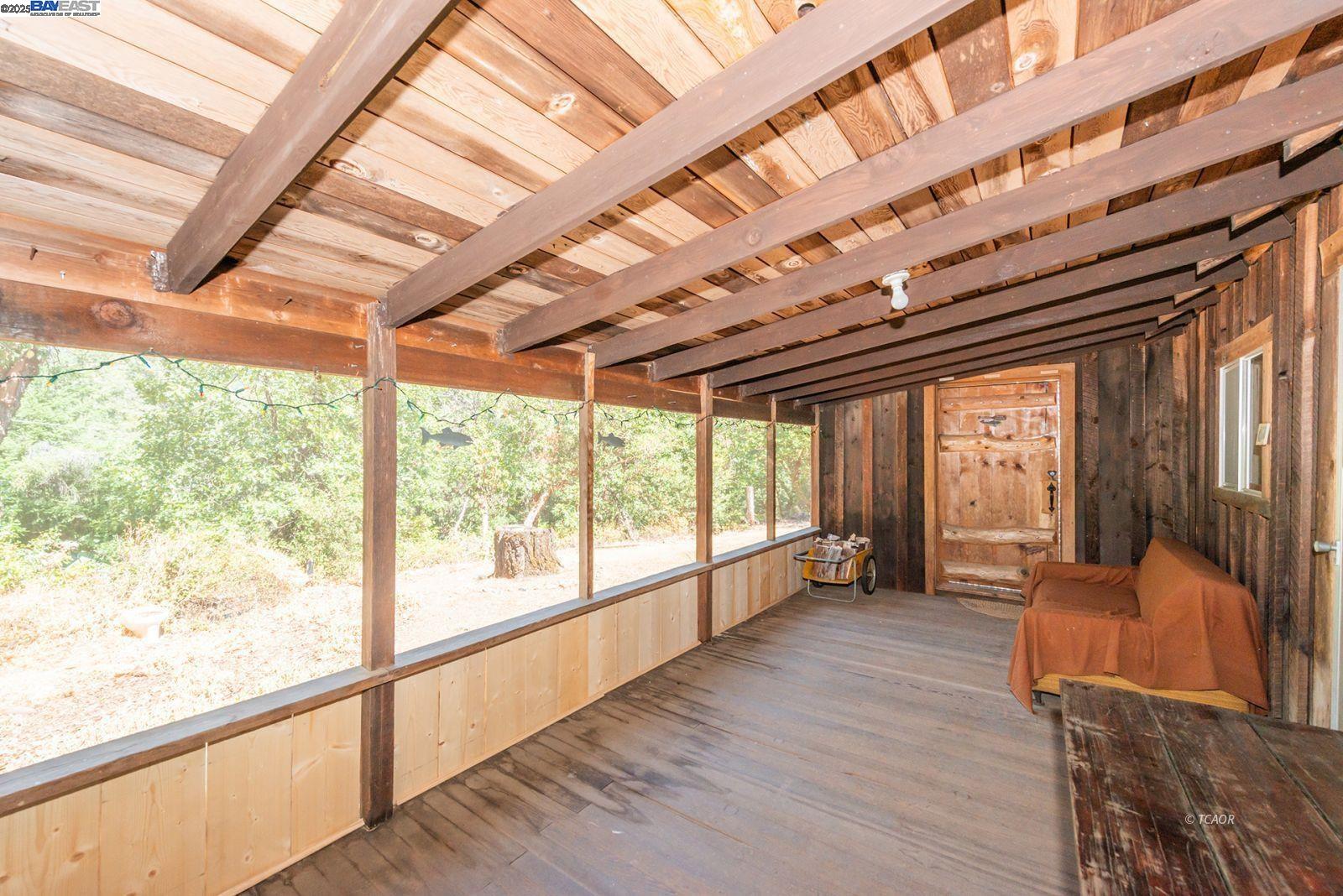 181 Price Creek Road Big Bar, CA 96010 - Photo 25 of 49 a view of an empty room with wooden floor and furniture