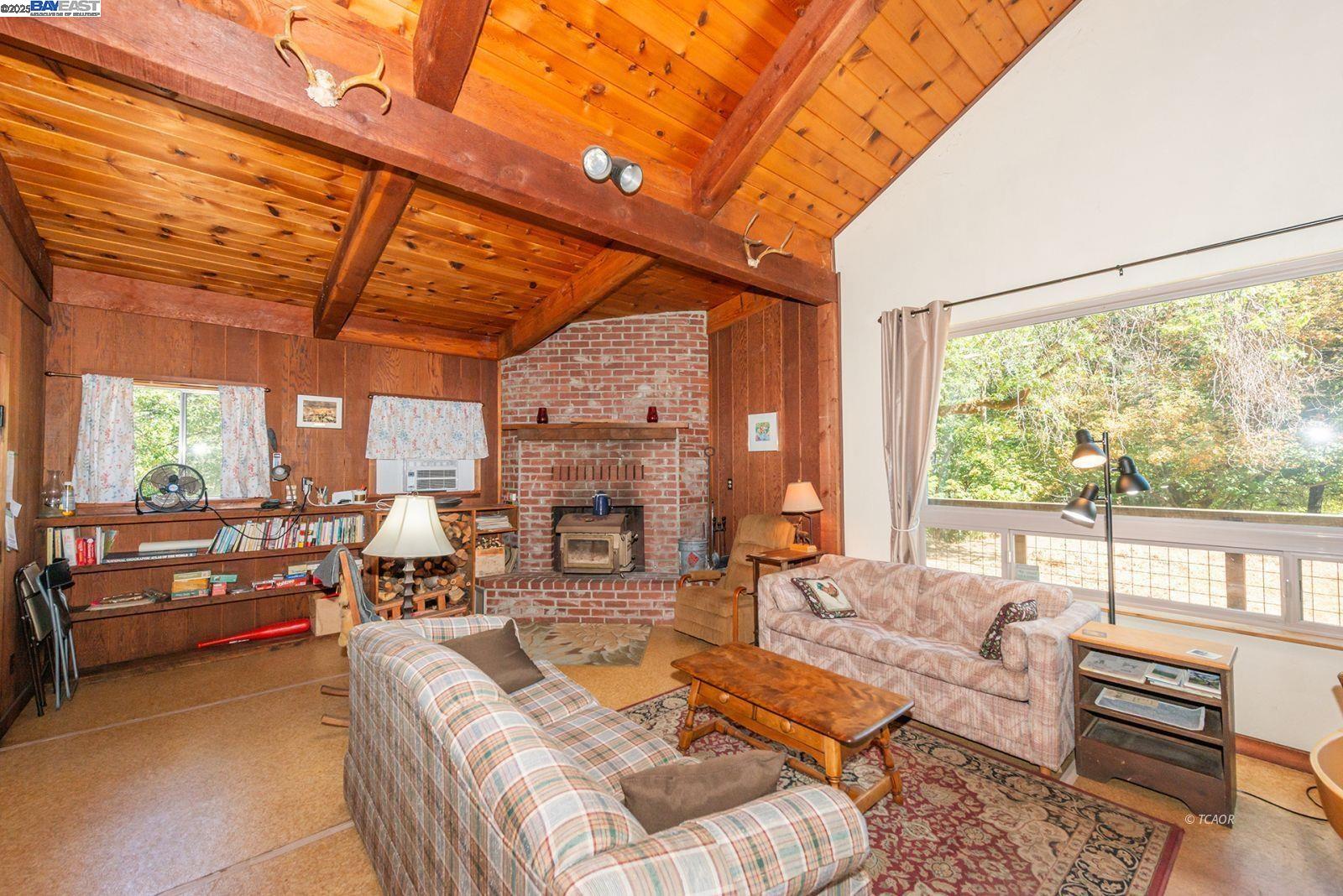 181 Price Creek Road Big Bar, CA 96010 - Photo 6 of 49 a living room with furniture and a large window
