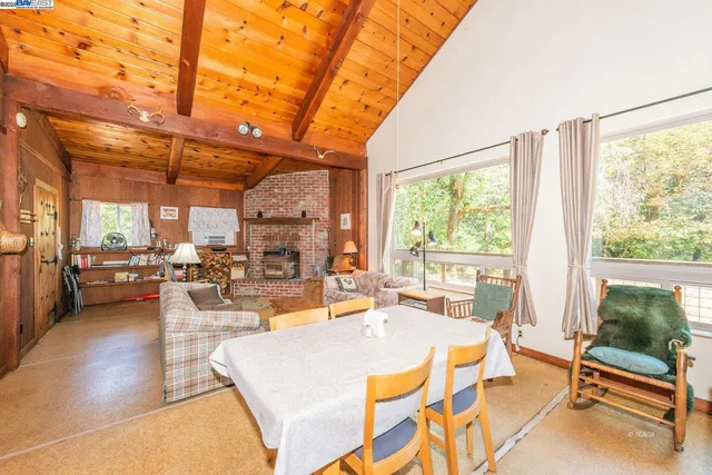 a room with lots of windows and tables