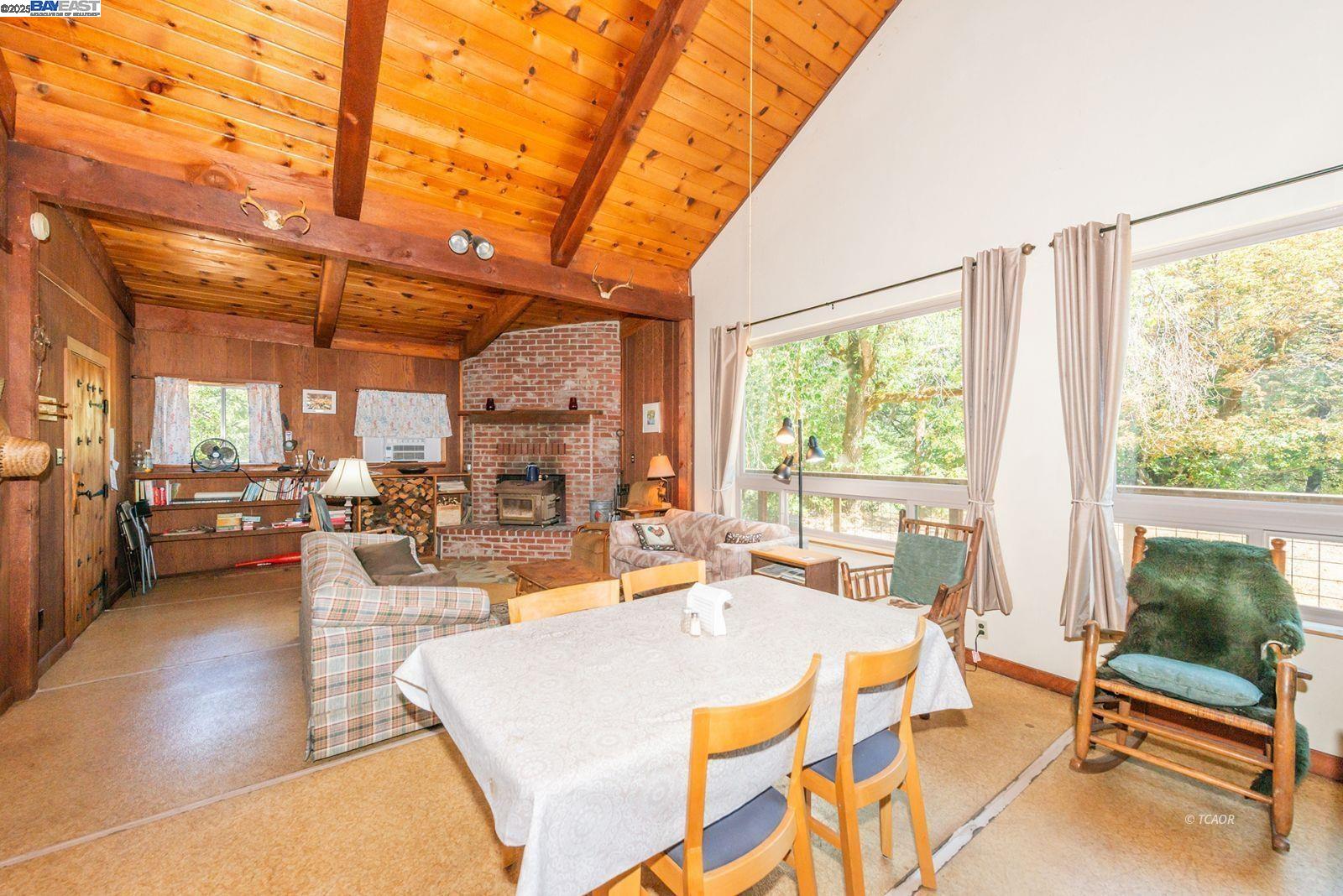 181 Price Creek Road Big Bar, CA 96010 - Photo 8 of 49 a living room with patio furniture and a large window