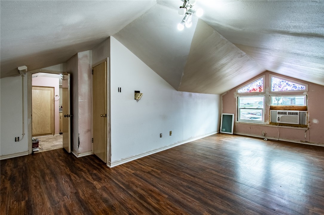 4502 Marie Street Corpus Christi, TX 78411 - Photo 22 of 26 an empty room with wooden floor and windows