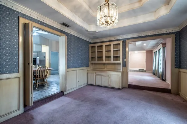 a view of hall way with furniture