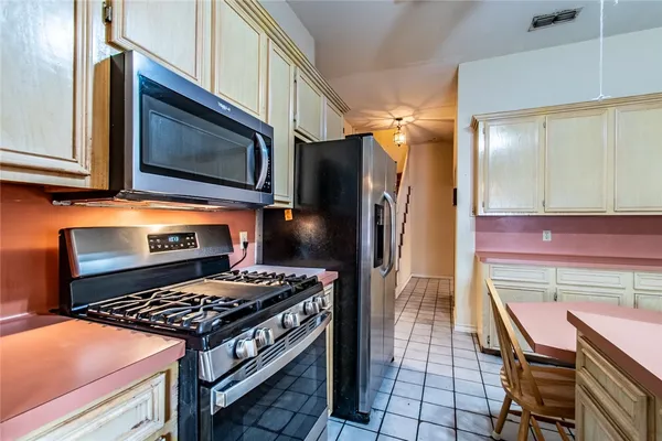 a kitchen with a stove and a microwave