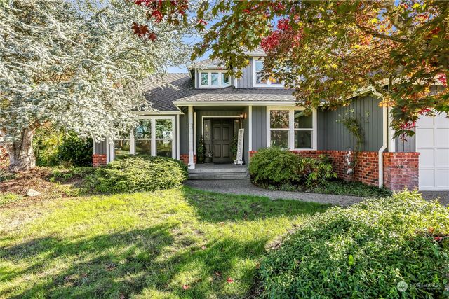 front view of a house with a garden
