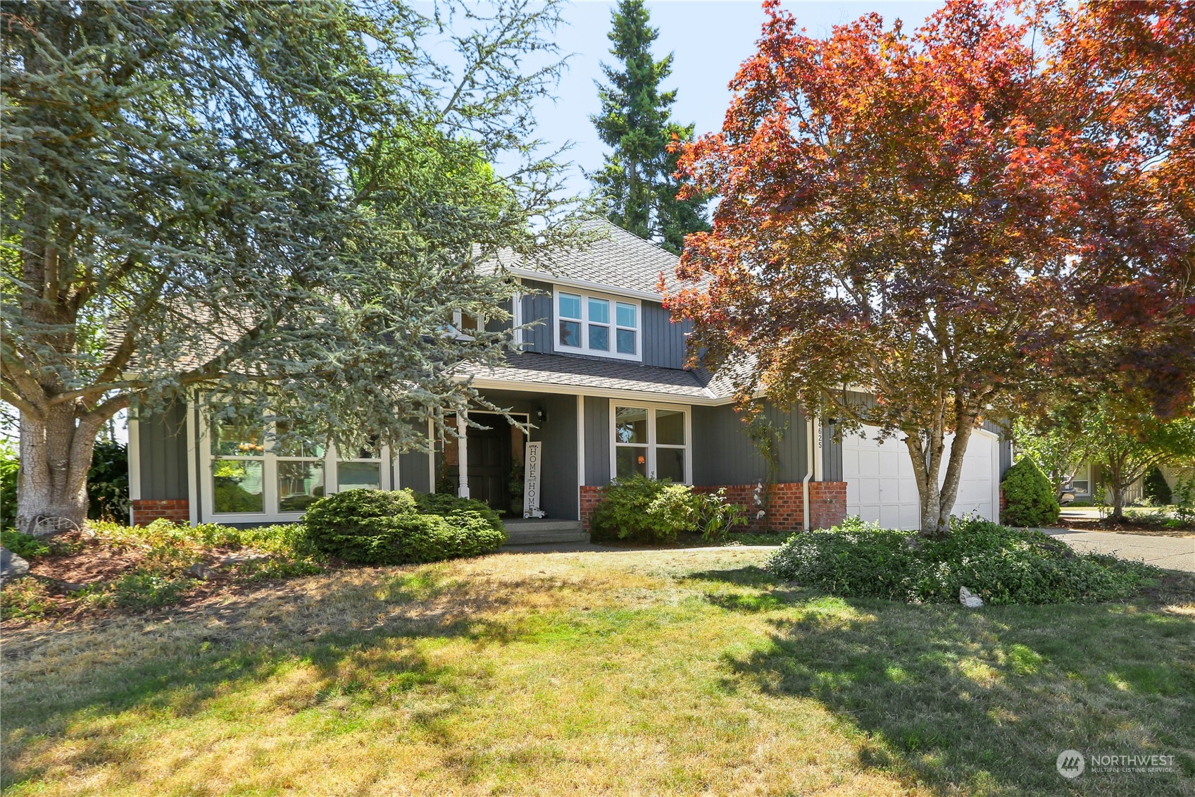 4625 Northeast 18th Street Renton, WA 98059 - Photo 1 of 35 a front view of a house with garden