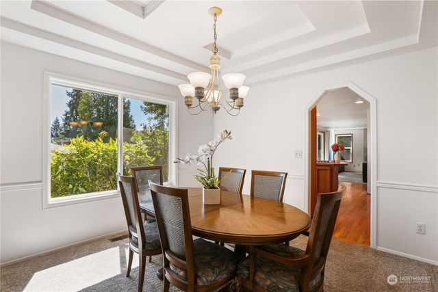 a view of a dining room with furniture window and outside view
