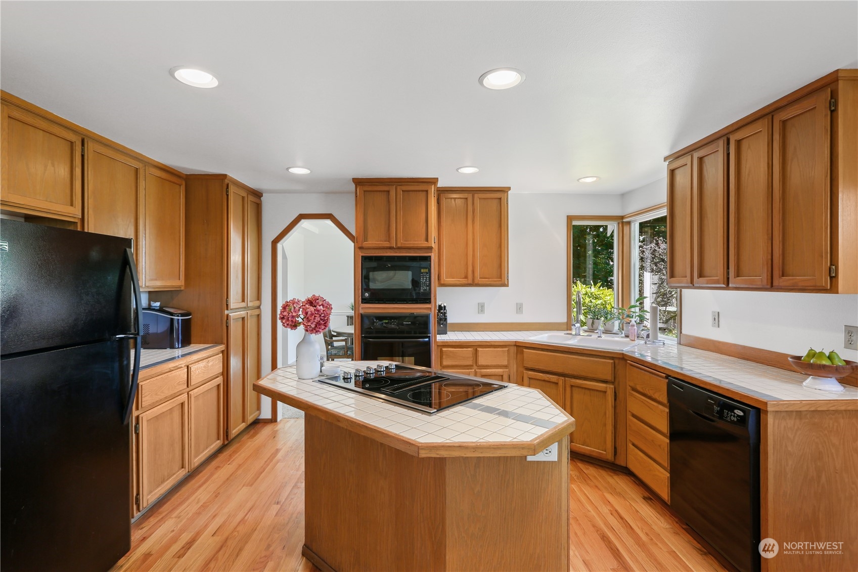 4625 Northeast 18th Street Renton, WA 98059 - Photo 12 of 35 a kitchen that has a sink and a stove in it