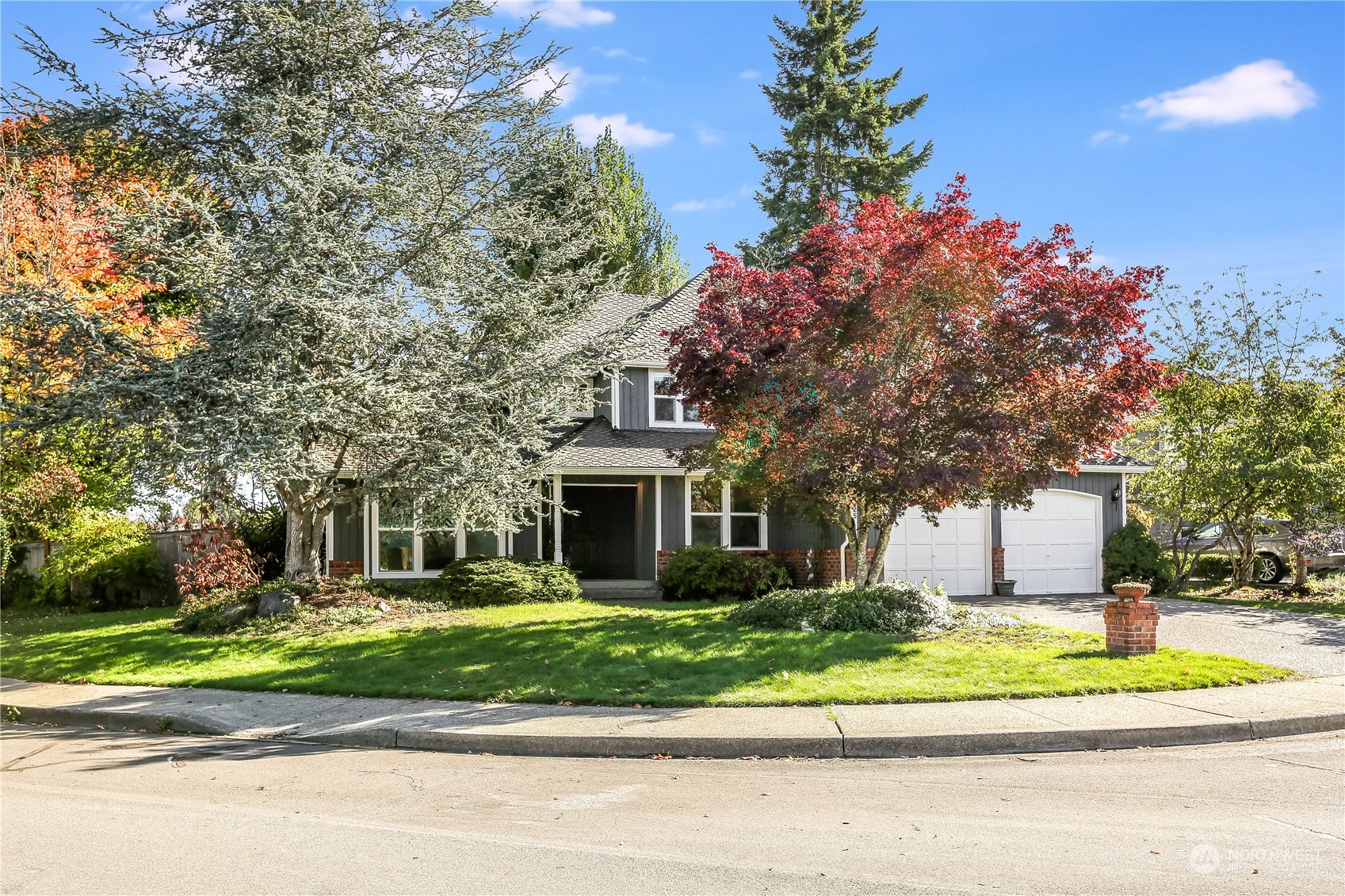 4625 Northeast 18th Street Renton, WA 98059 - Photo 34 of 35 a front view of a house with a yard and potted plants