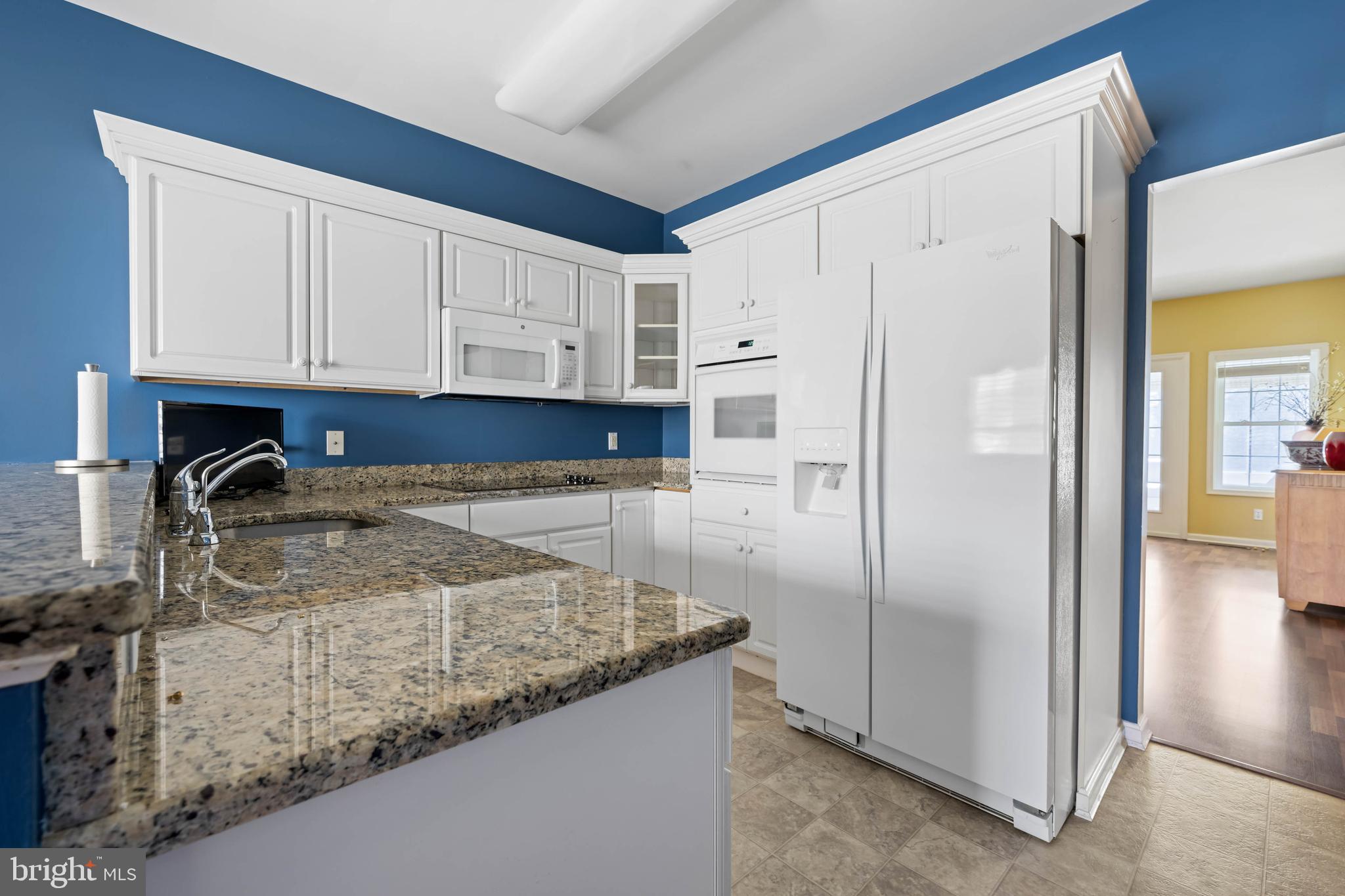929 Winding Way Salisbury, MD 21804 - Photo 11 of 31 a kitchen with granite countertop a refrigerator and a sink