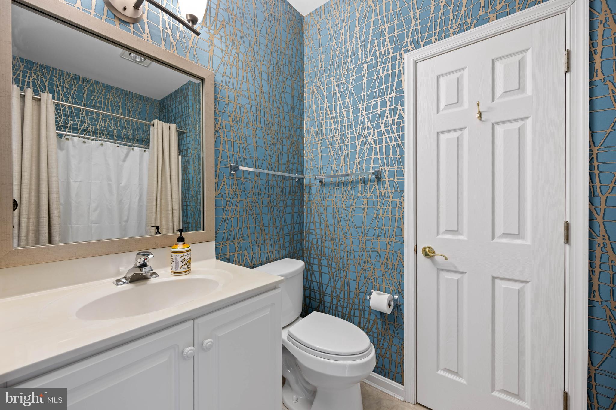 929 Winding Way Salisbury, MD 21804 - Photo 19 of 31 a bathroom with a sink toilet and shower
