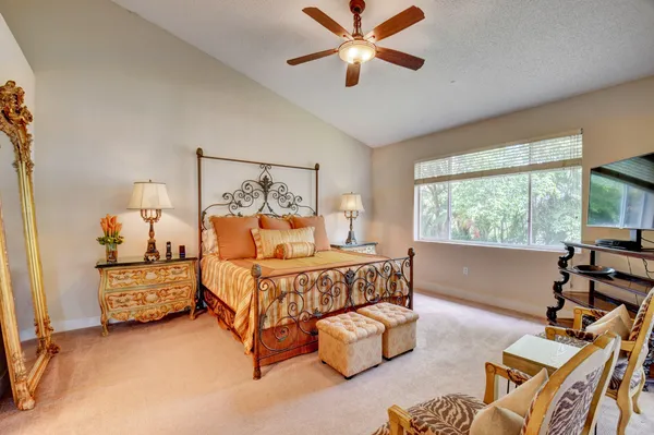 a bed room with a bed and a window